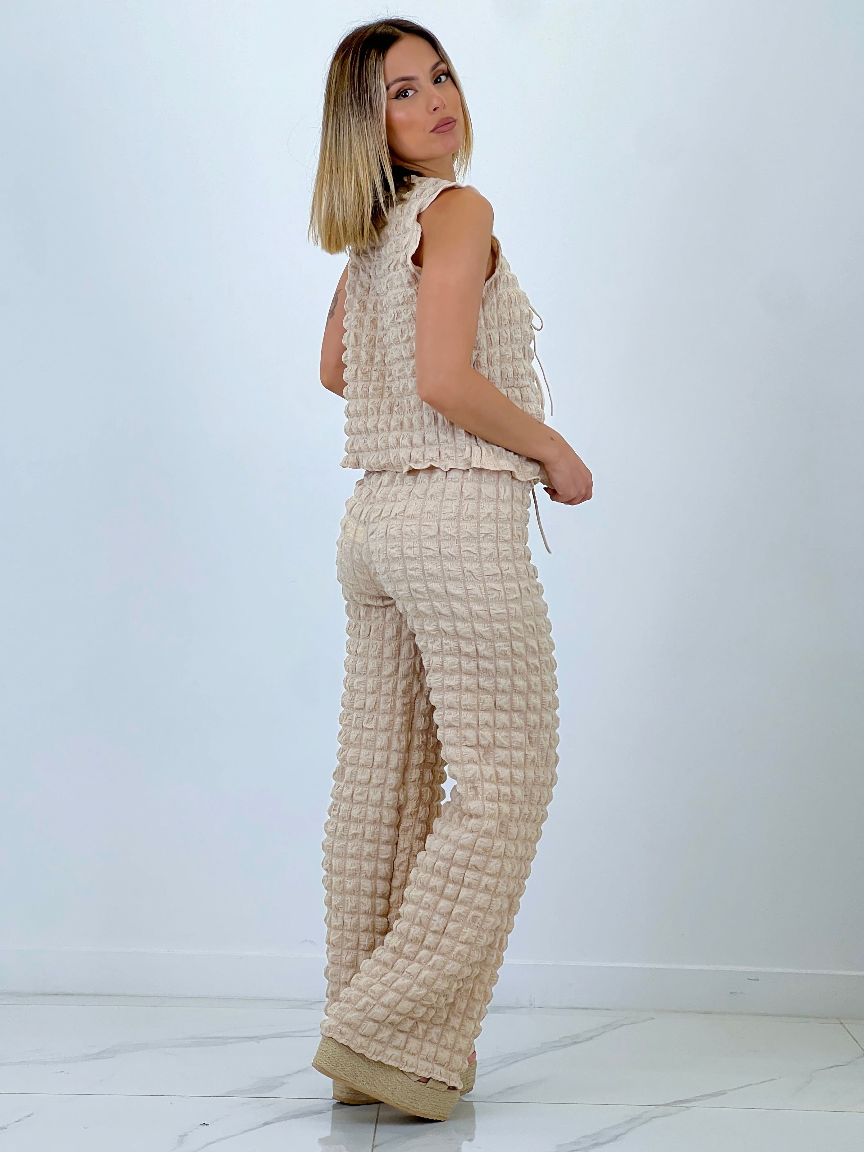 Conjunt armilla pantaló flare