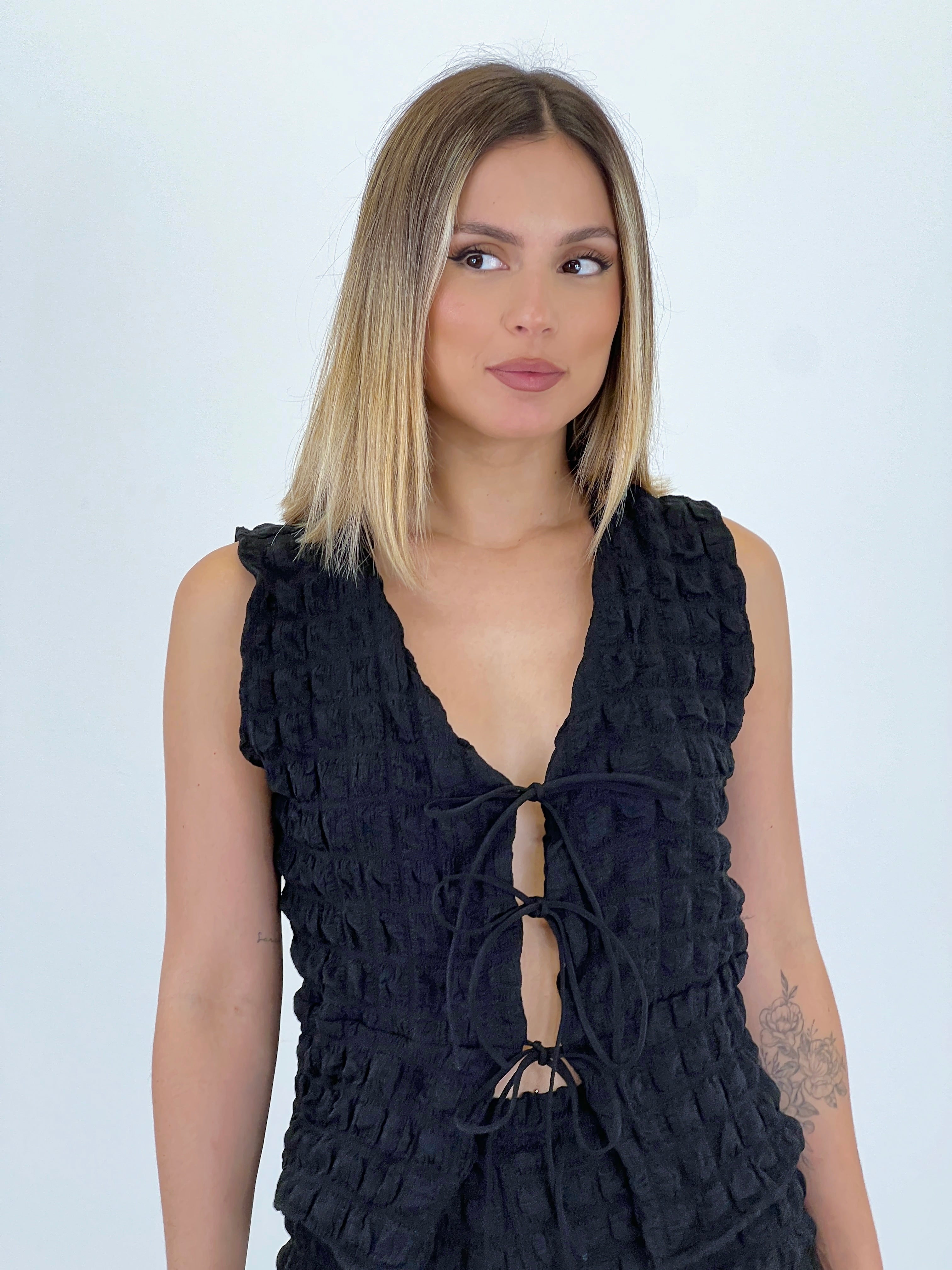 Conjunt armilla pantaló flare