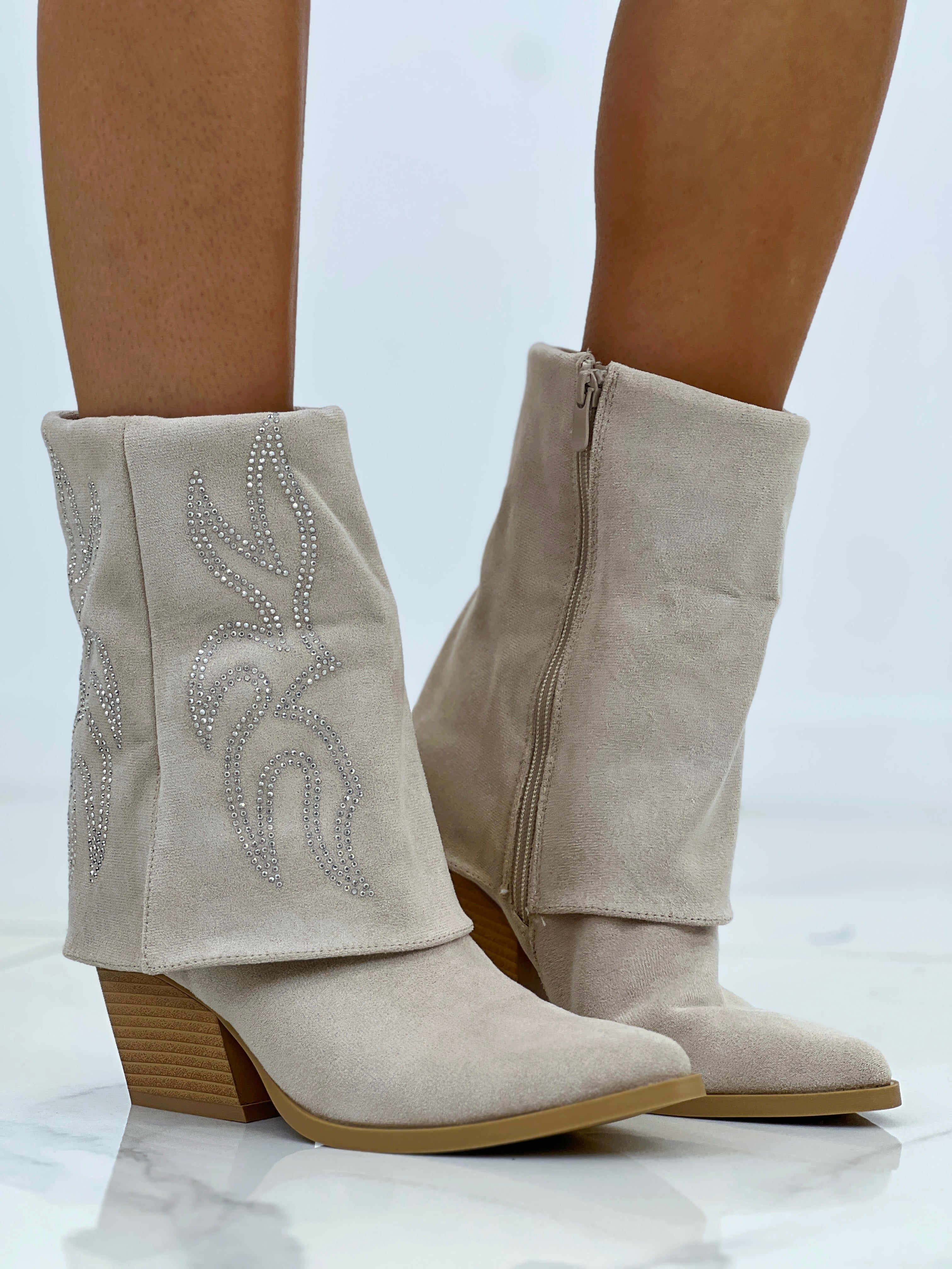 Bota cowboy ante Denver