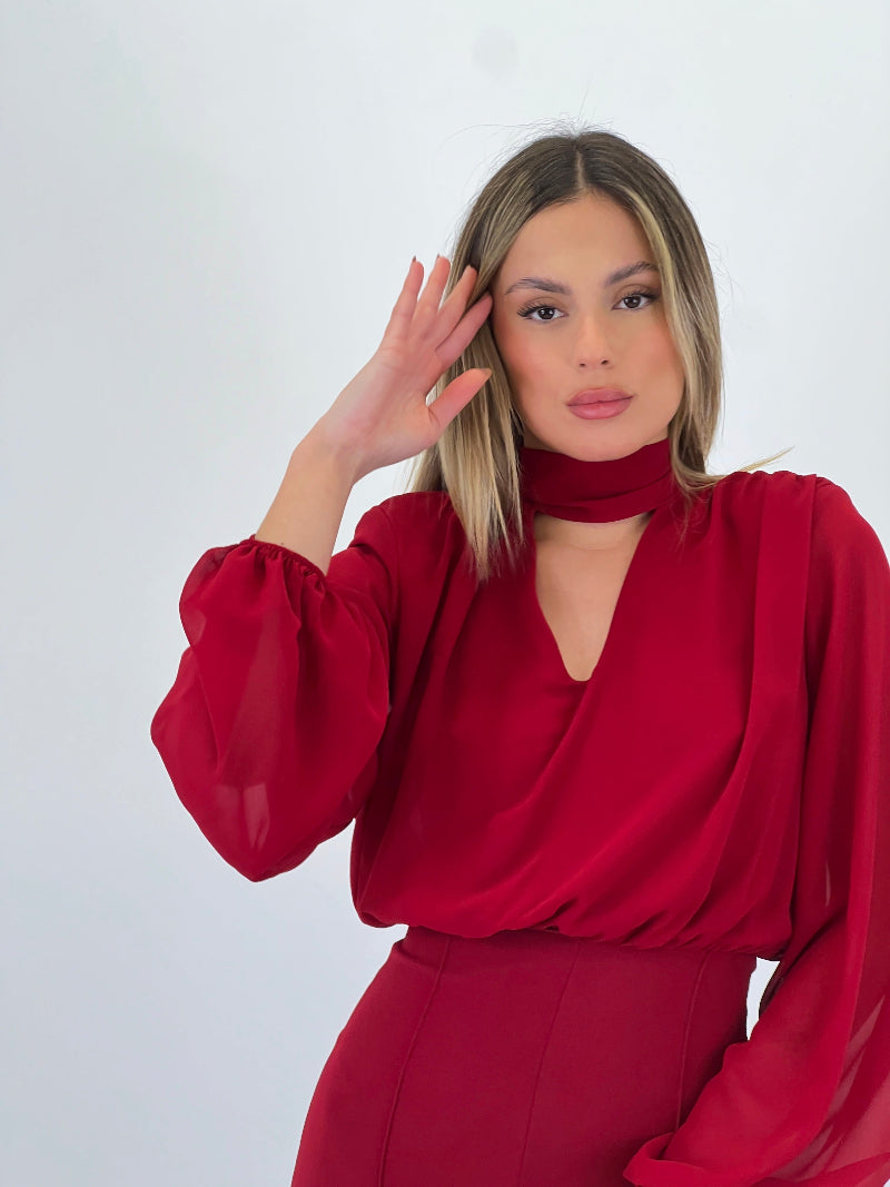 Long-sleeved choker jumpsuit with transparencies