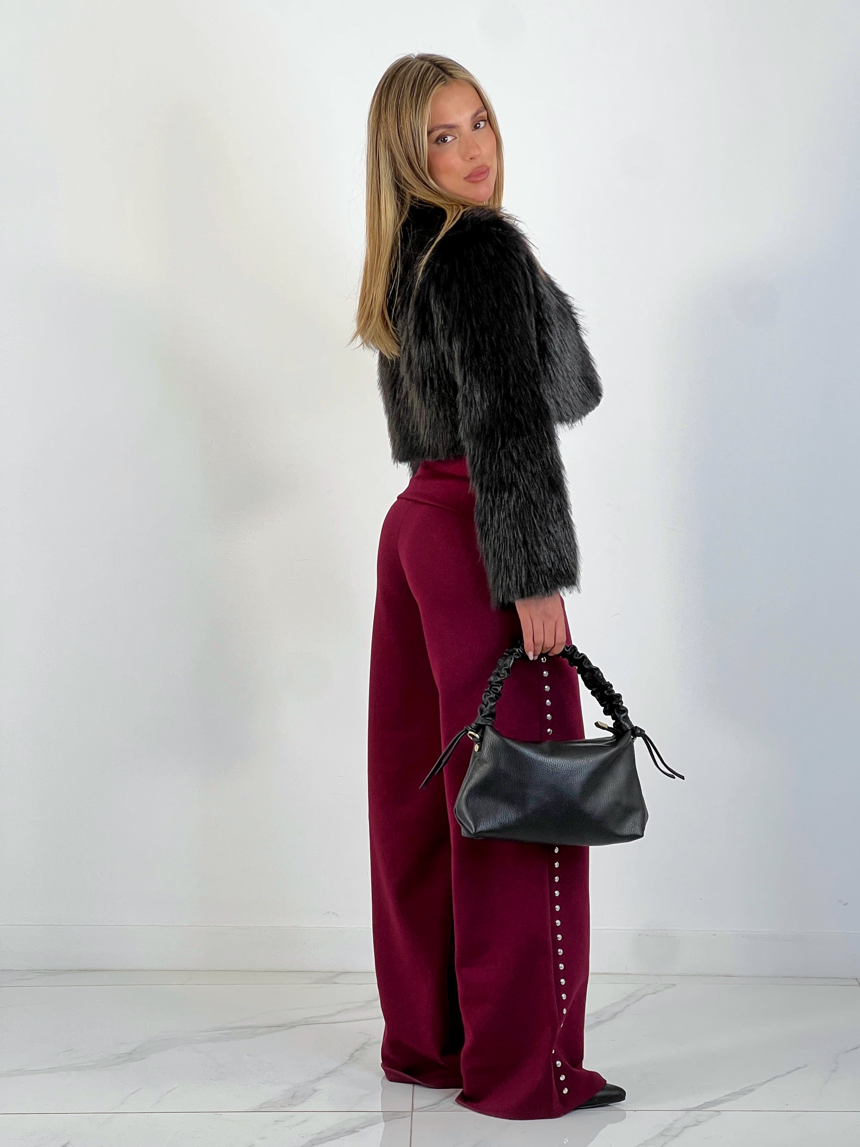 Pantalón tachuelas cintura vuelta