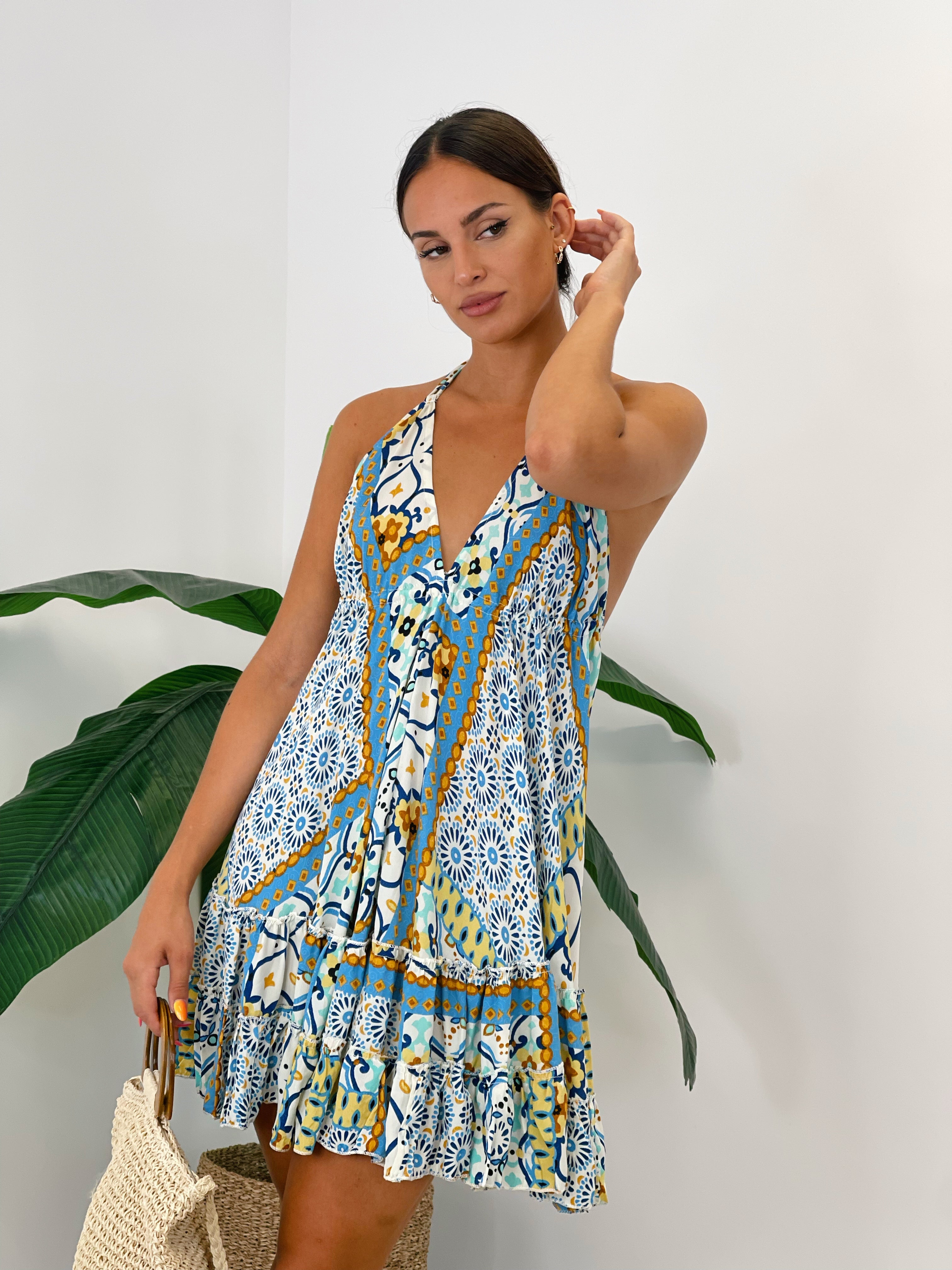 Vestido corto con volante y doble tirante fino anudado al cuello color azul | Zebra&Maduixa