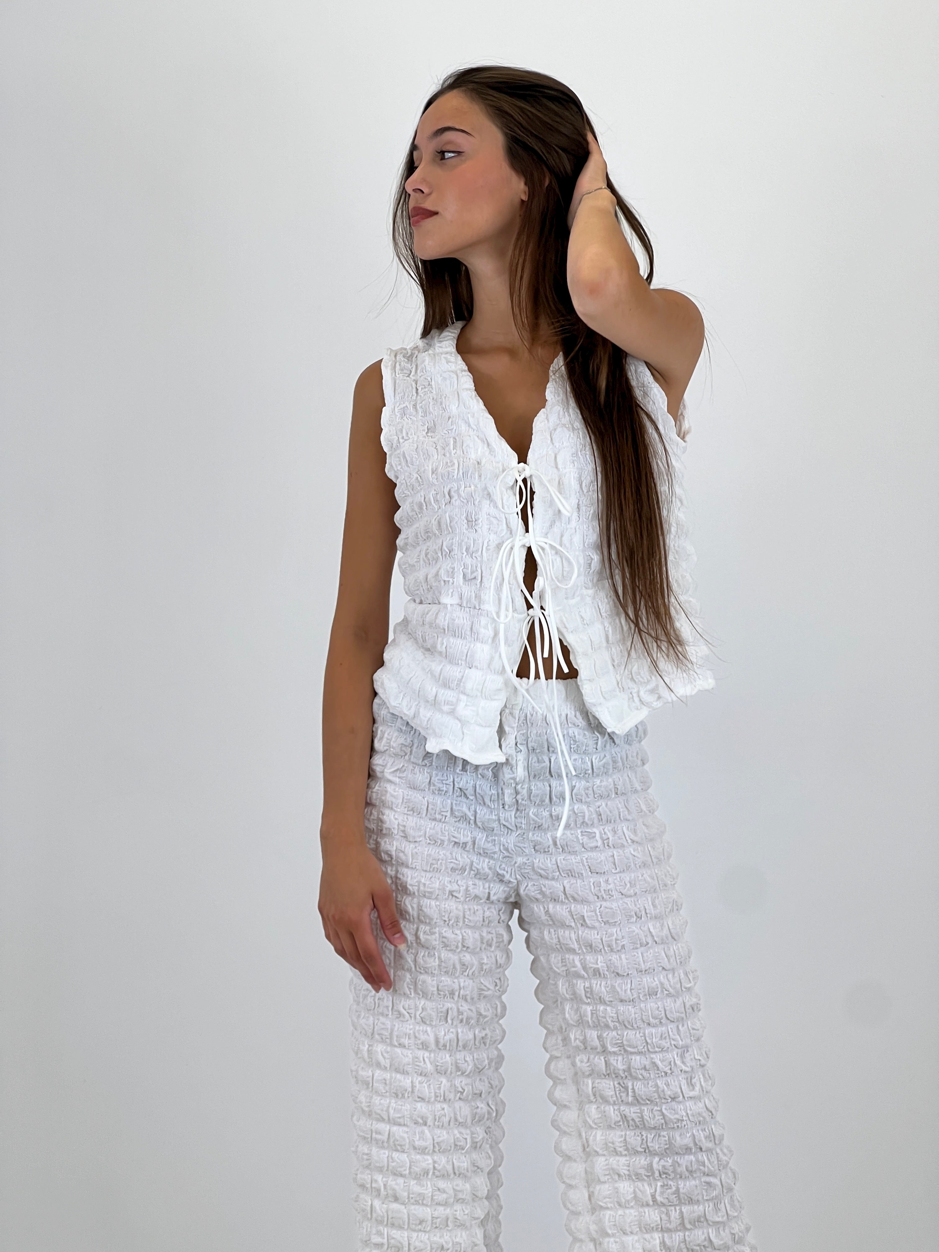 Conjunto chaleco pantalón flare