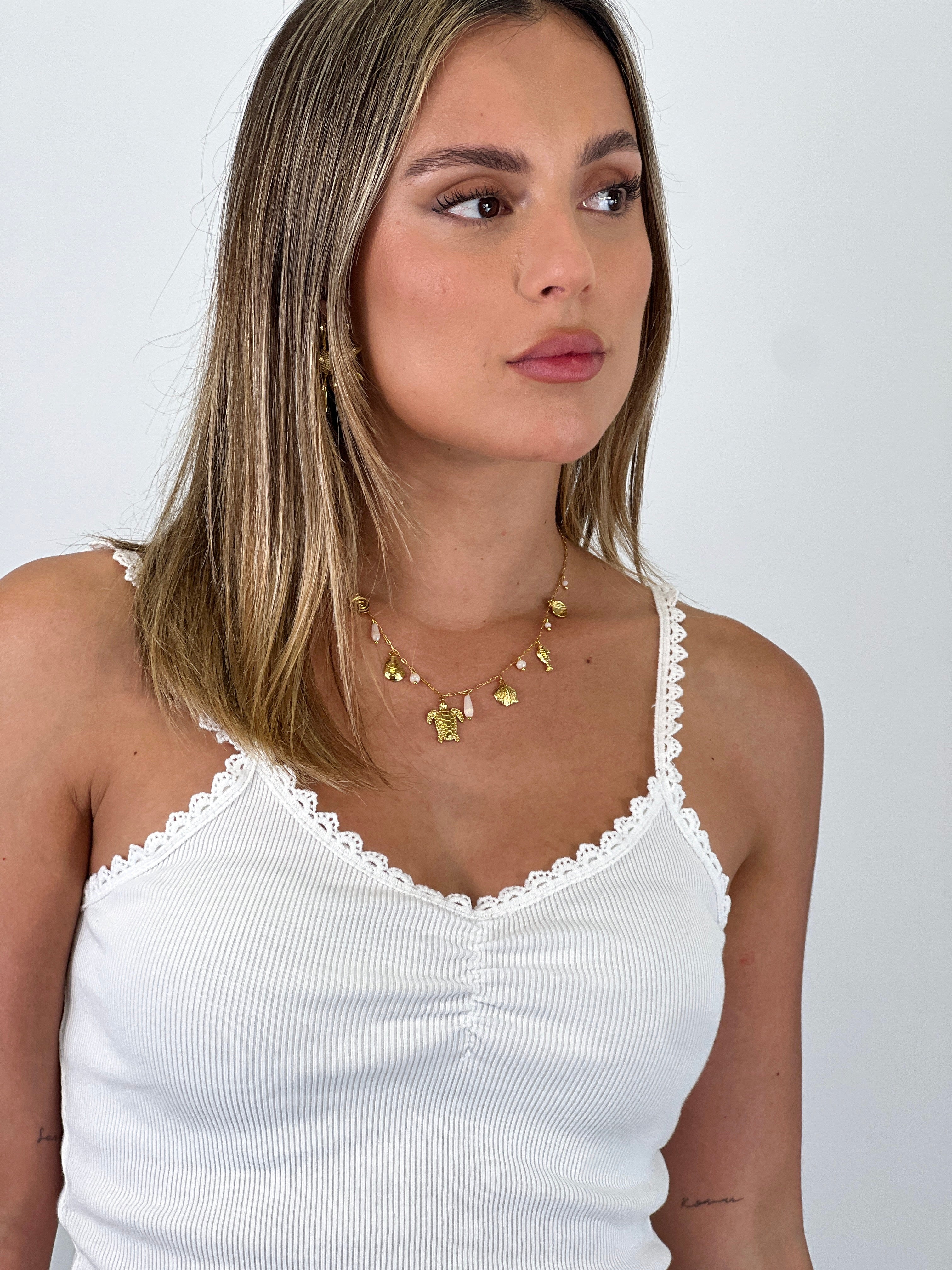 Necklace with dangling beads