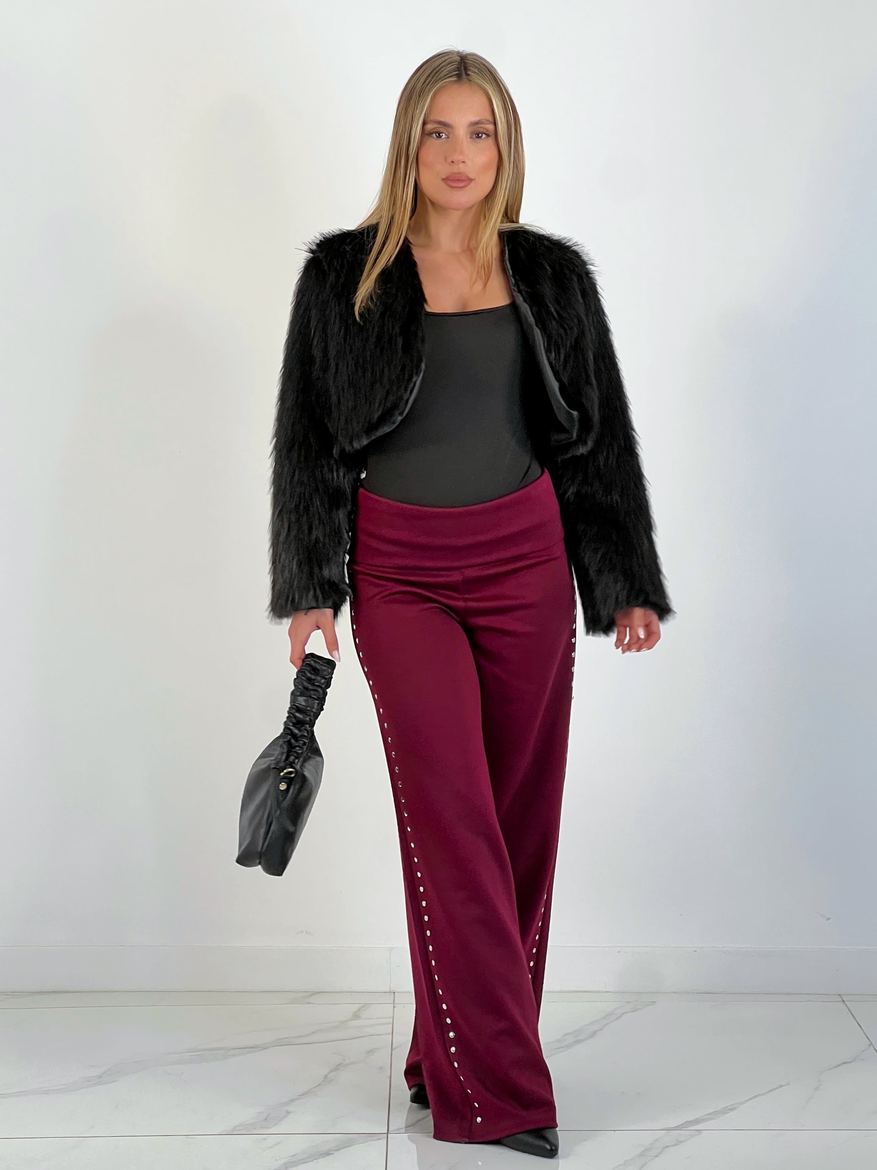 Pantalón tachuelas cintura vuelta