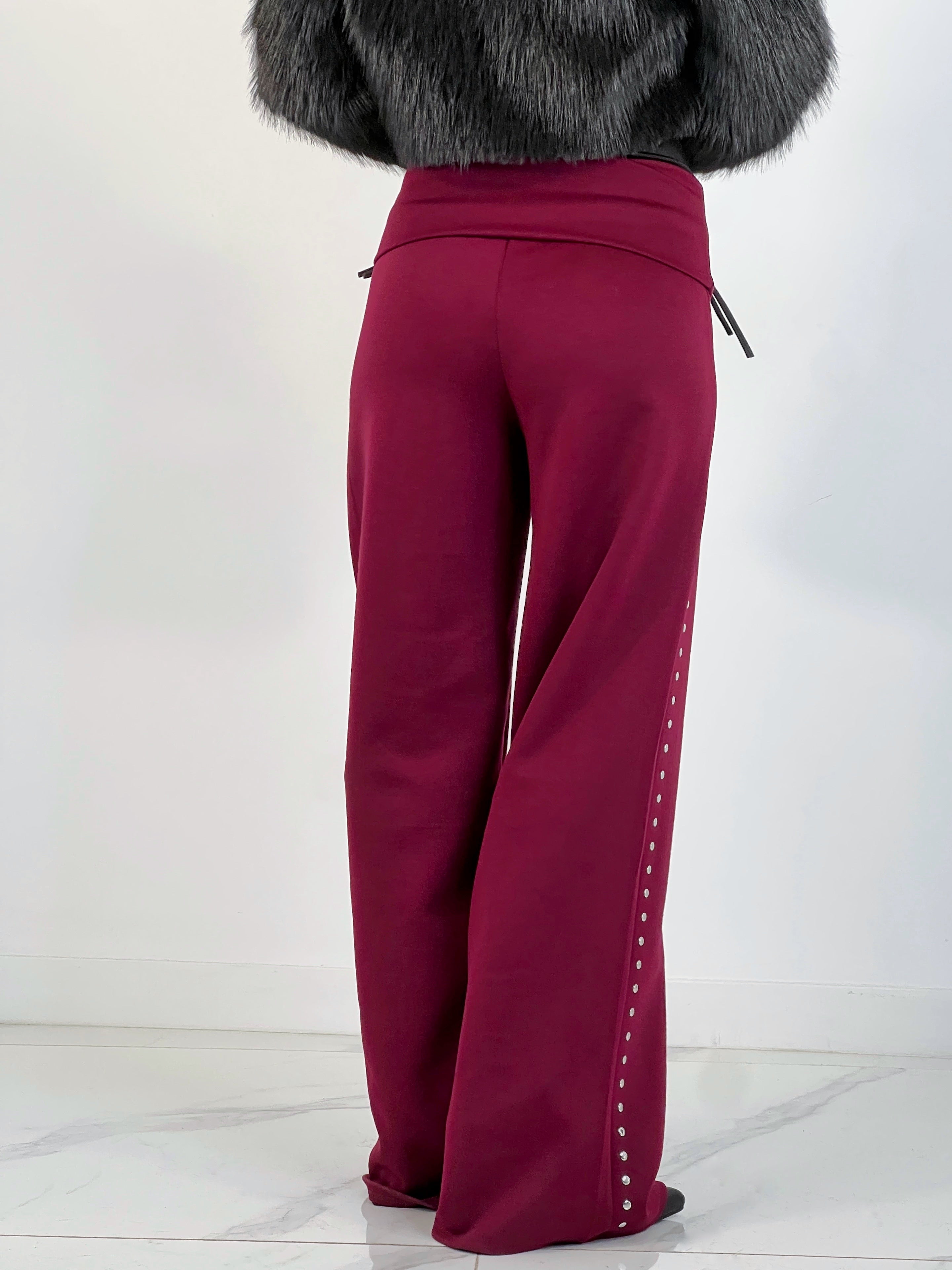 Pantalón tachuelas cintura vuelta