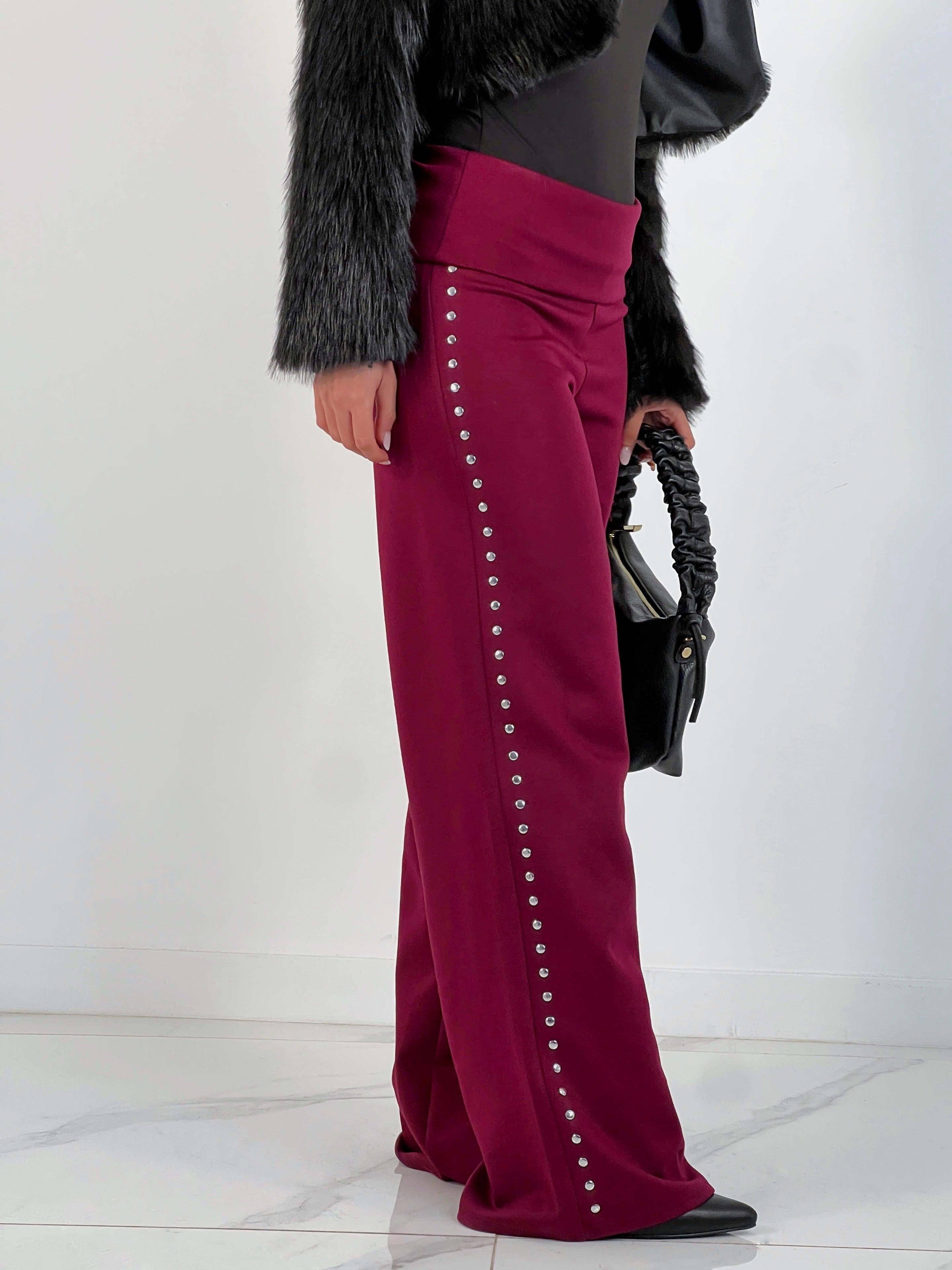 Pantalón tachuelas cintura vuelta